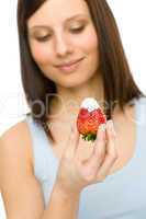 Healthy lifestyle - woman eat strawberry