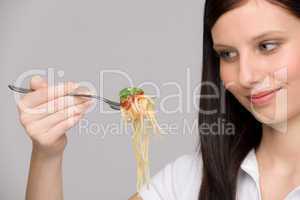 Italian food - healthy woman eat spaghetti sauce