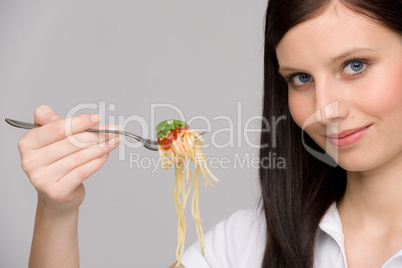 Italian food - healthy woman eat spaghetti sauce