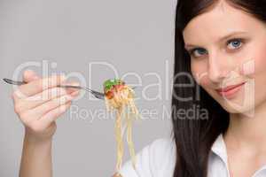 Italian food - healthy woman eat spaghetti sauce