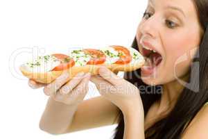 Healthy lifestyle - woman eat caprese sandwich