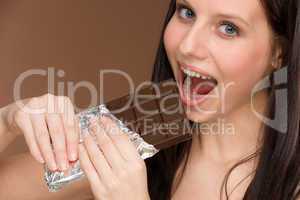 Chocolate - portrait young woman bite sweets