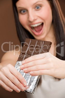 Chocolate - portrait young woman bite sweets