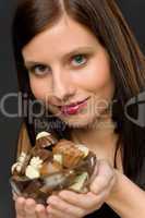 Chocolate - portrait young woman hold candy