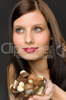 Chocolate - portrait young woman hold candy