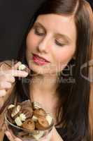 Chocolate - portrait young healthy woman eat candy