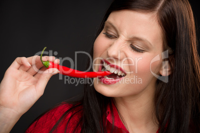 Chili pepper - portrait young woman red spicy