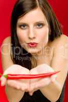 Chili pepper - portrait young woman hold red spicy