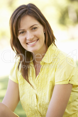 Portrait Of Young Woman In Park