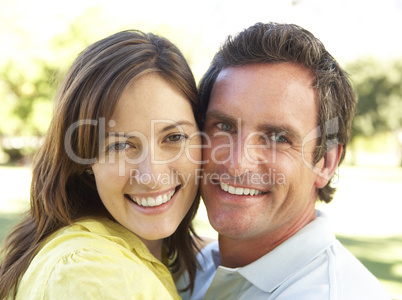 Portrait Of Romantic Couple In Park