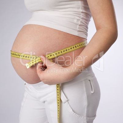 Woman Measuring Her Belly