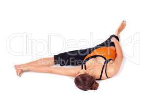 Fit Woman Practicing Reclining Big Toe Yoga Pose