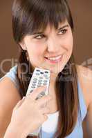 Woman teenager hold remote control