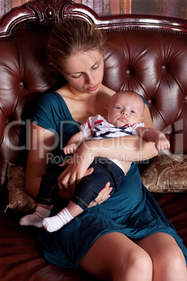 Mother with Her Baby on Sofa