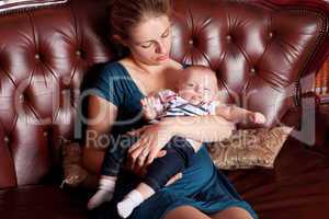 Mother with Her Baby on Sofa
