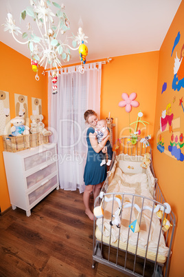 Mother with Child in a Baby Room