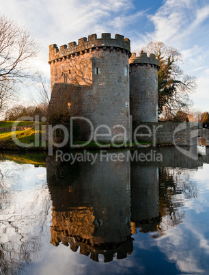 Whittington Castle in Shropshire reflecting on moat