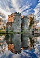 Whittington Castle in Shropshire reflecting on moat