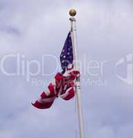 US Flag tied in a knot on pole