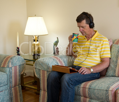 Boomer reading on tablet computer Boomer reading on tablet computer