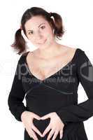 Pregnant woman hands in form of heart sign