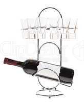 bottle of wine on a metal stand with glasses