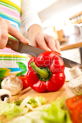 Woman's hands cutting vegetables