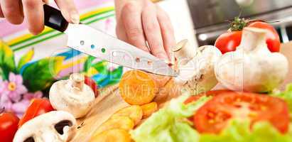 Woman's hands cutting vegetables