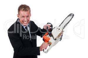 Young businessman with chainsaw