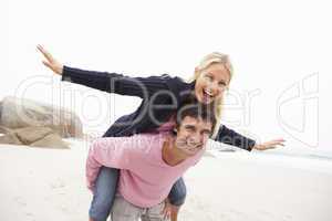 Man Giving Woman Piggyback