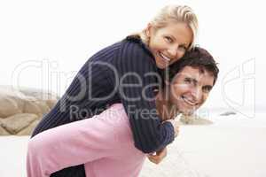 Man Giving Woman Piggyback
