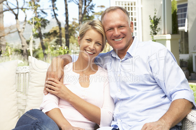 Couple Relaxing In Garden