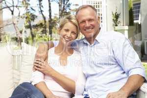 Couple Relaxing In Garden