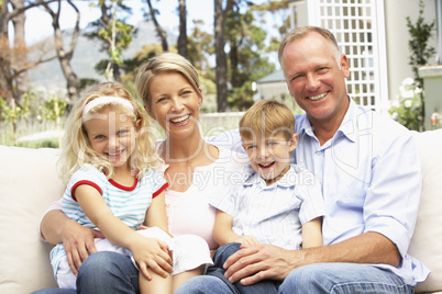 Family Relaxing In Garden