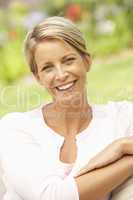 Young Woman Relaxing In Garden