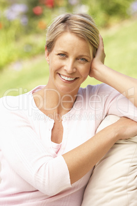 Young Woman Relaxing In Garden