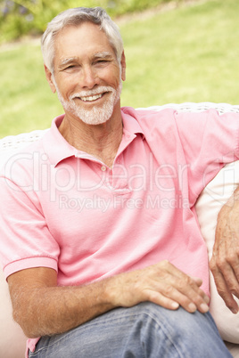 Senior Man Relaxing In Garden