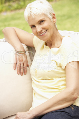 Senior Woman Relaxing In Garden