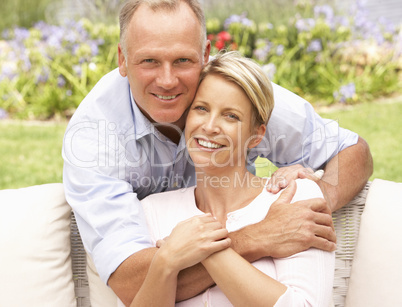 Couple Relaxing In Garden