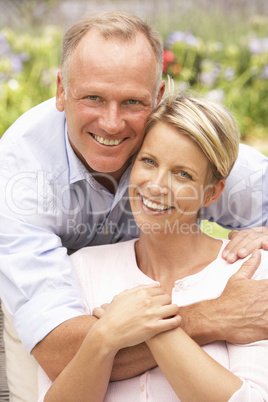 Couple Relaxing In Garden