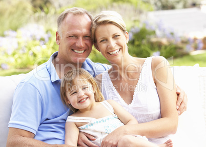 Family Relaxing In Garden