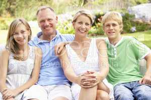 Family Relaxing In Garden