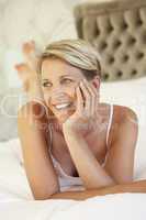 Young Woman Relaxing In Bedroom