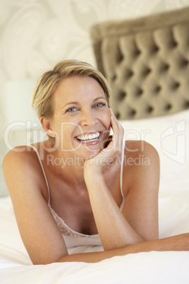 Young Woman Relaxing In Bedroom