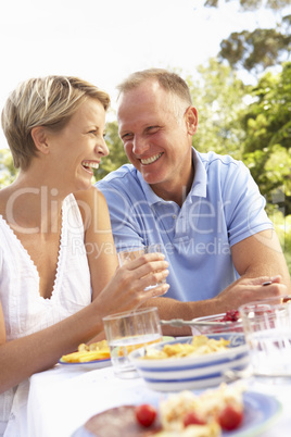 Couple Enjoying Meal In Garden