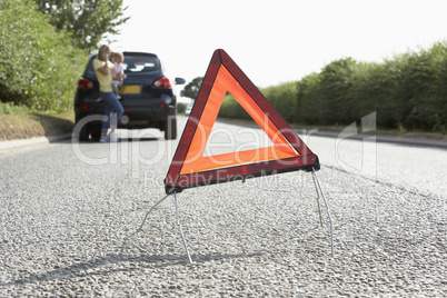Mother And Daughter Broken Down On Country Road With Hazard Warn