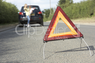 Mother And Daughter Broken Down On Country Road With Hazard Warn