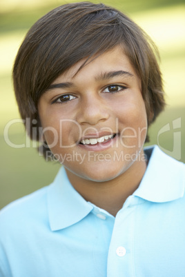 Portrait Of Young Boy In Park