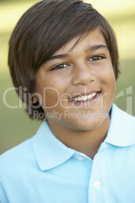 Portrait Of Young Boy In Park