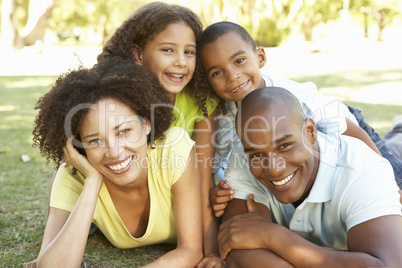 Portrait of Happy Family Piled Up In Park